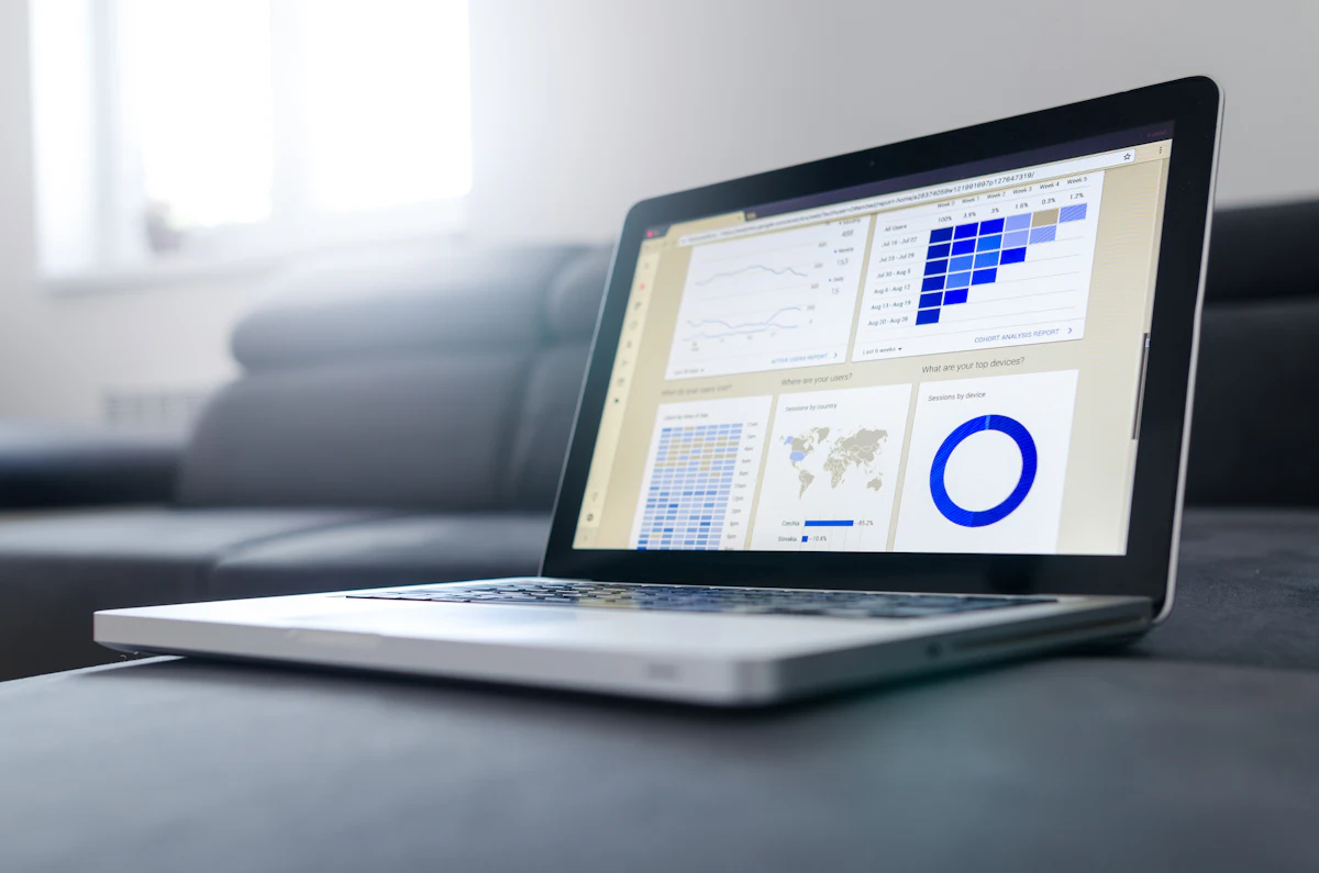 Laptop displaying organized business reports on a desk