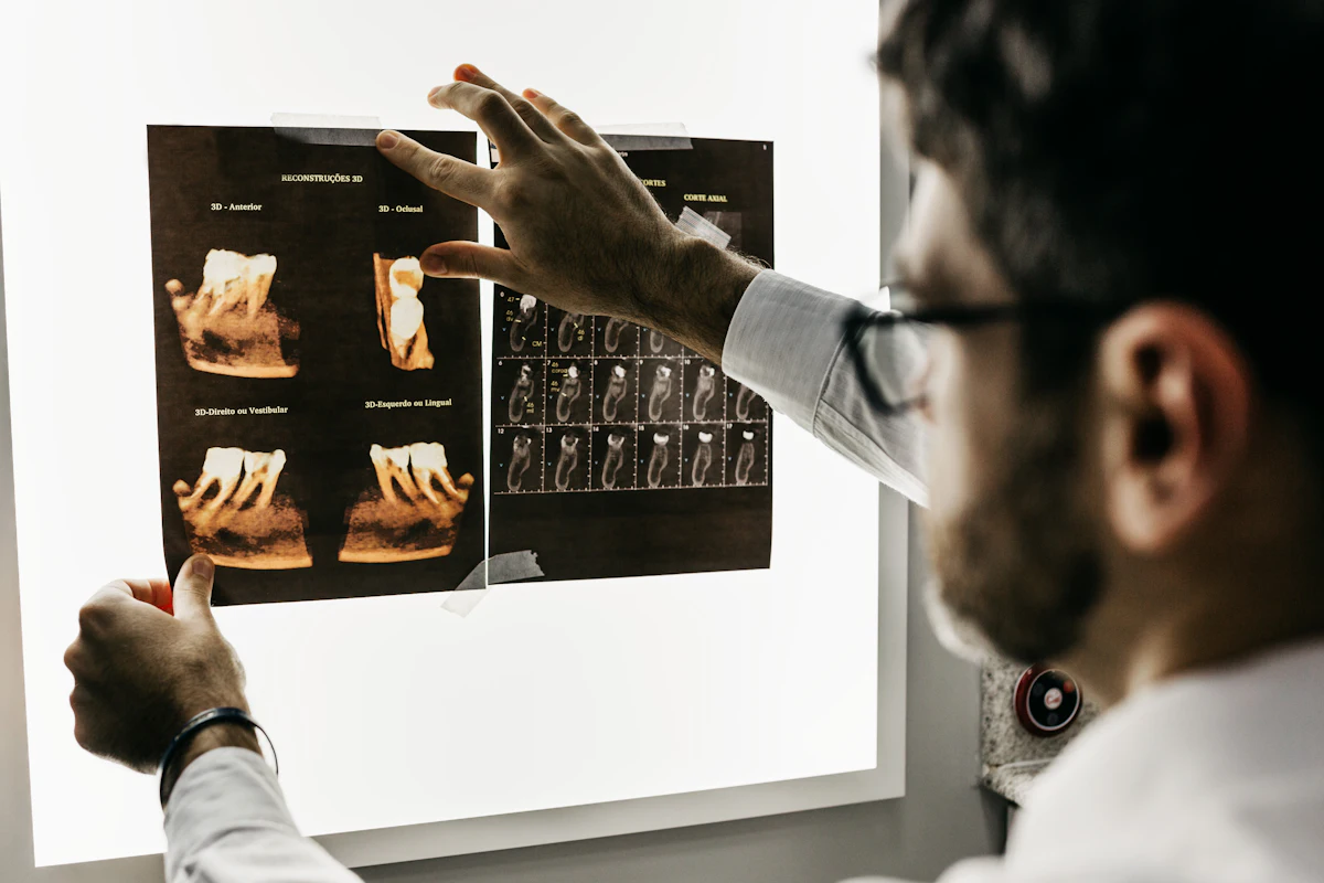 Dentist reviewing dental X-ray images