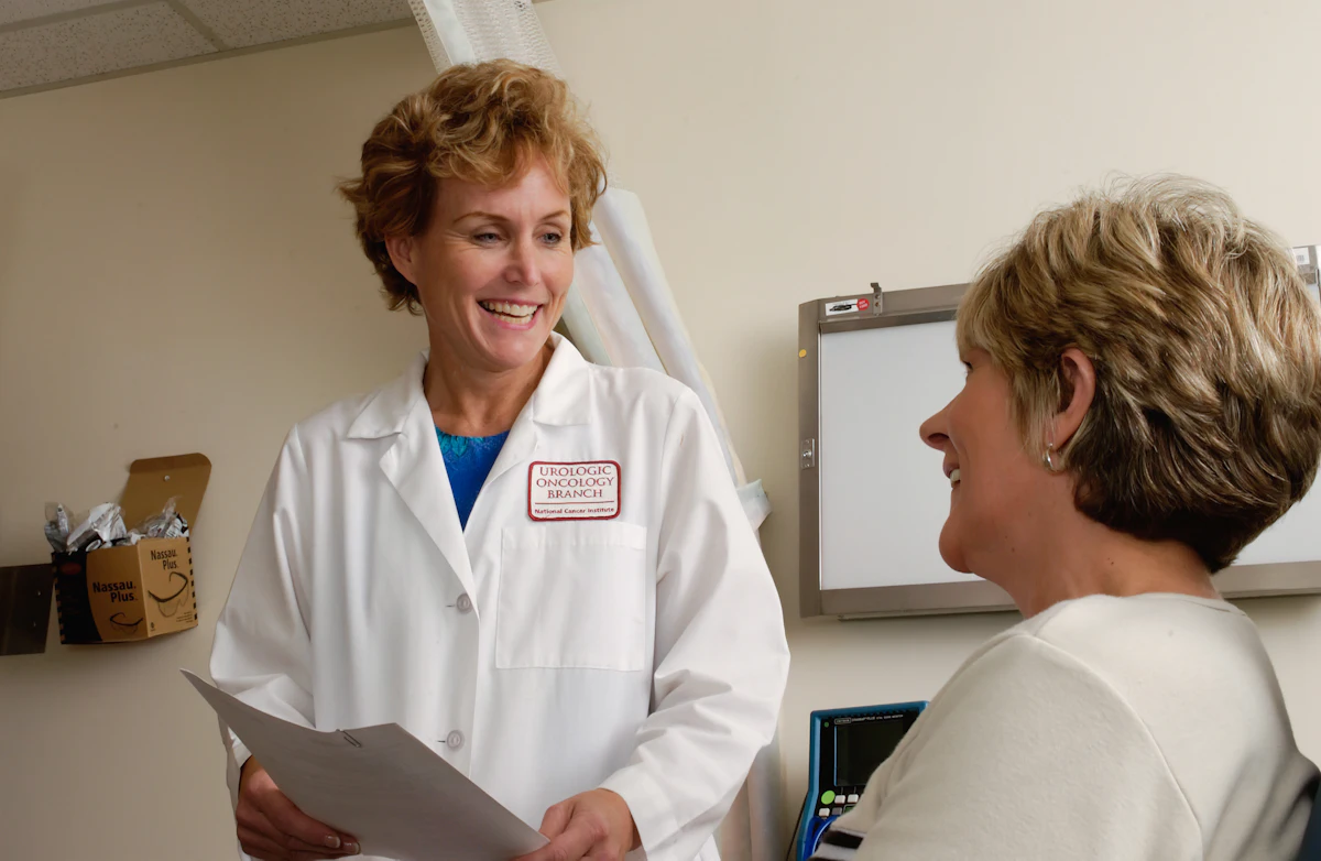 Physician in conversation with a colleague in a medical office
